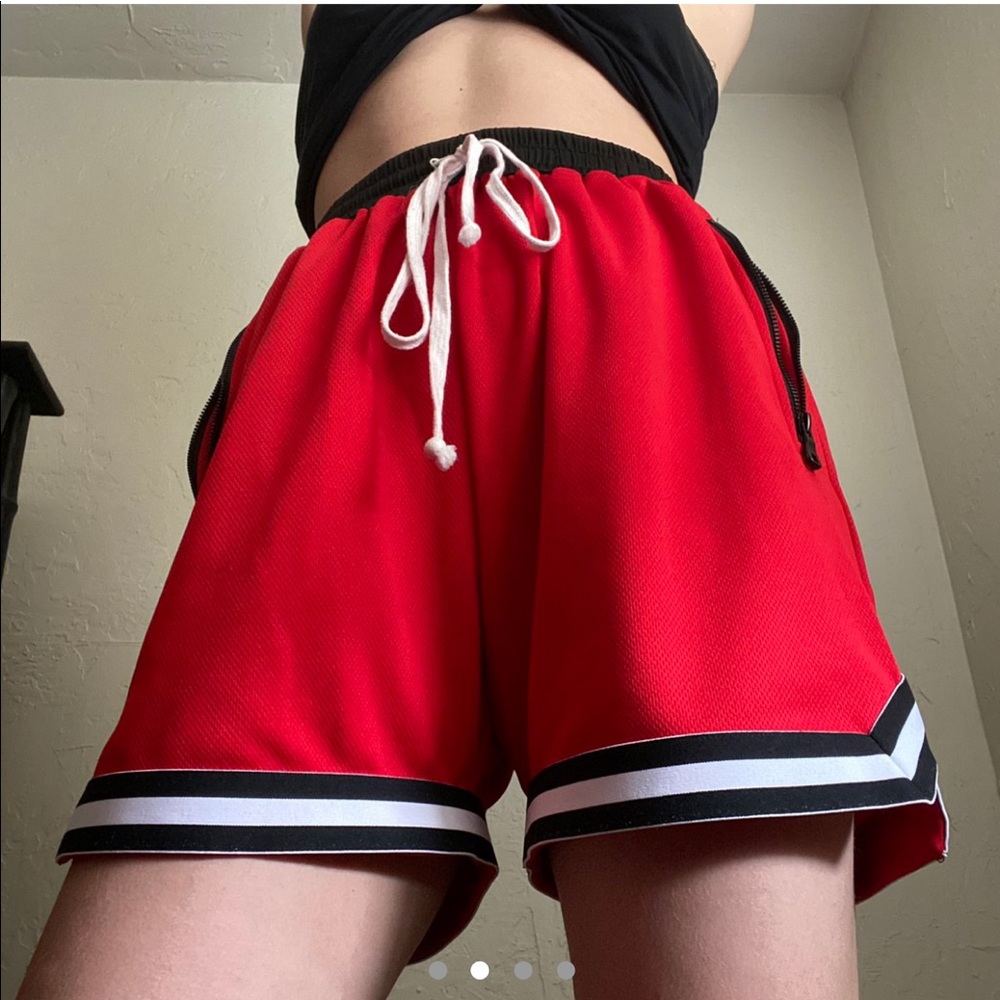 Red, white, and black basketball shorts
